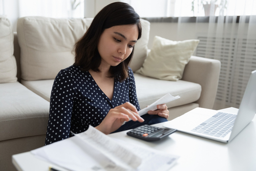 A woman using a calculator