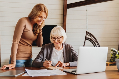 Lady and daughter looking at a document