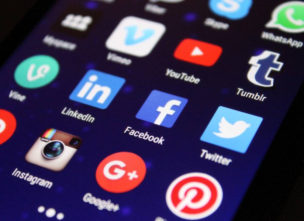 A phone screen displaying social media icons